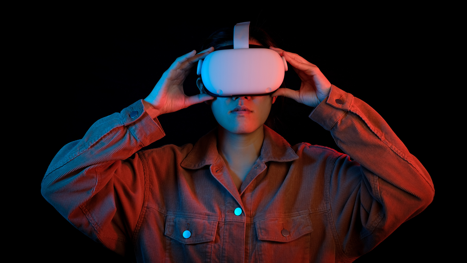 Teen with virtual reality glasses on a black background